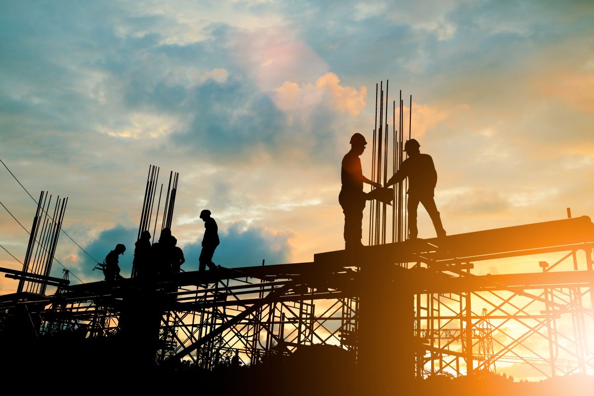 Silhouette of engineer and construction team working at site