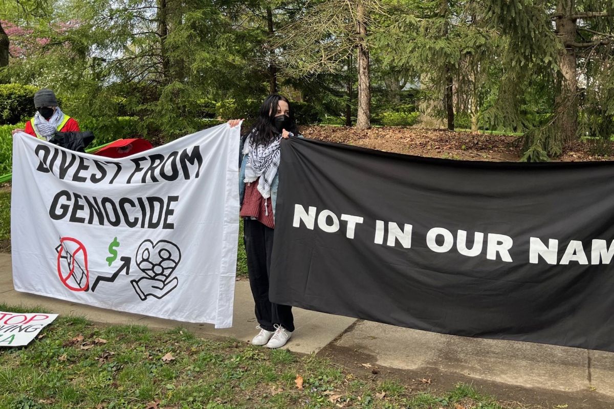 Pro-Palestinian protesters stand outside Gov. Eric Holcomb's residence in mid-town Indianapolis on Thursday, April 25, 2024.
