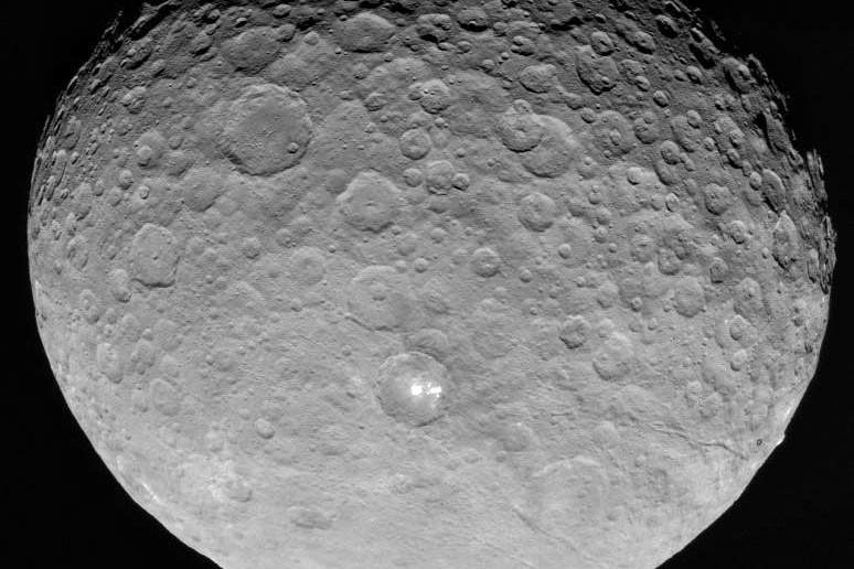 an image of Ceres with a bright spot on it. Transmitted by DAWN, edited by Stuart Rankin.