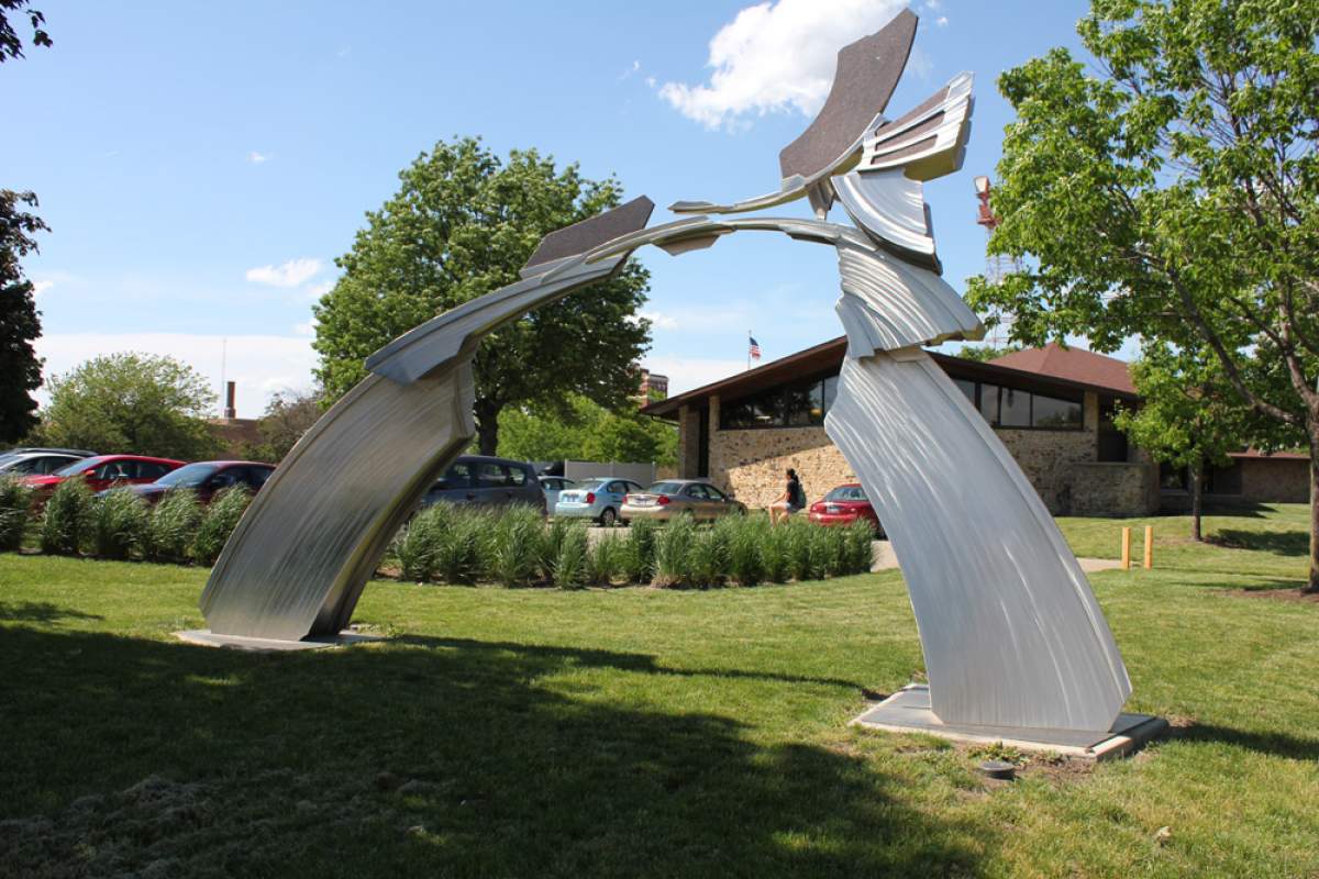 sculpture titled gatekeeper made of steel and granite