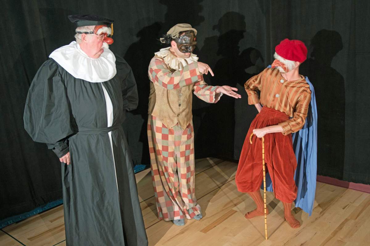 three masked characters from the play