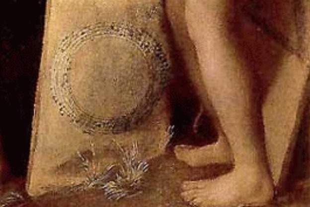 A detail from Dosso Dossi's painting Allegory of Music, showing canons written in circular and triangular form.