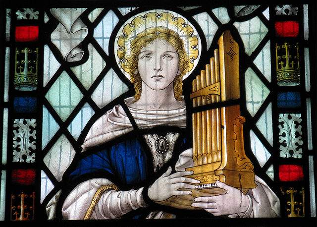A church window, featuring an image of St. Cecilia.