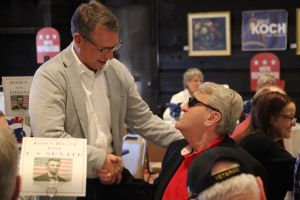 GOP candidate Eric Doden shakes hands with a voter at a Brown County event.