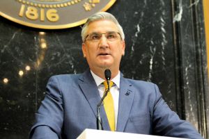 Indiana Gov. Eric Holcomb signs bills into law in a photo taken March 7, 2022.