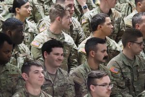 Indiana National Guard members listen as Gov. Eric Holcomb speaks at a departure ceremony on Thursday, March 28, 2024. Soldiers soon leave for Texas.