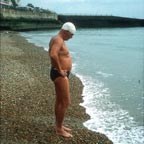 Doc stands on the shore at Dover, preparing to swim the English Channel.