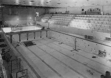 Royer Pool, an indoor facility, as it approached completion. Seating and the diving well are also shown.