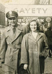 This grainy photo shows Counsilman in his Army uniform, together with Marj on the street in front of a store.