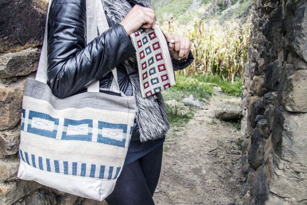 Model poses with Awamaki purse and Scarf (Photo courtesy of Awamaki)