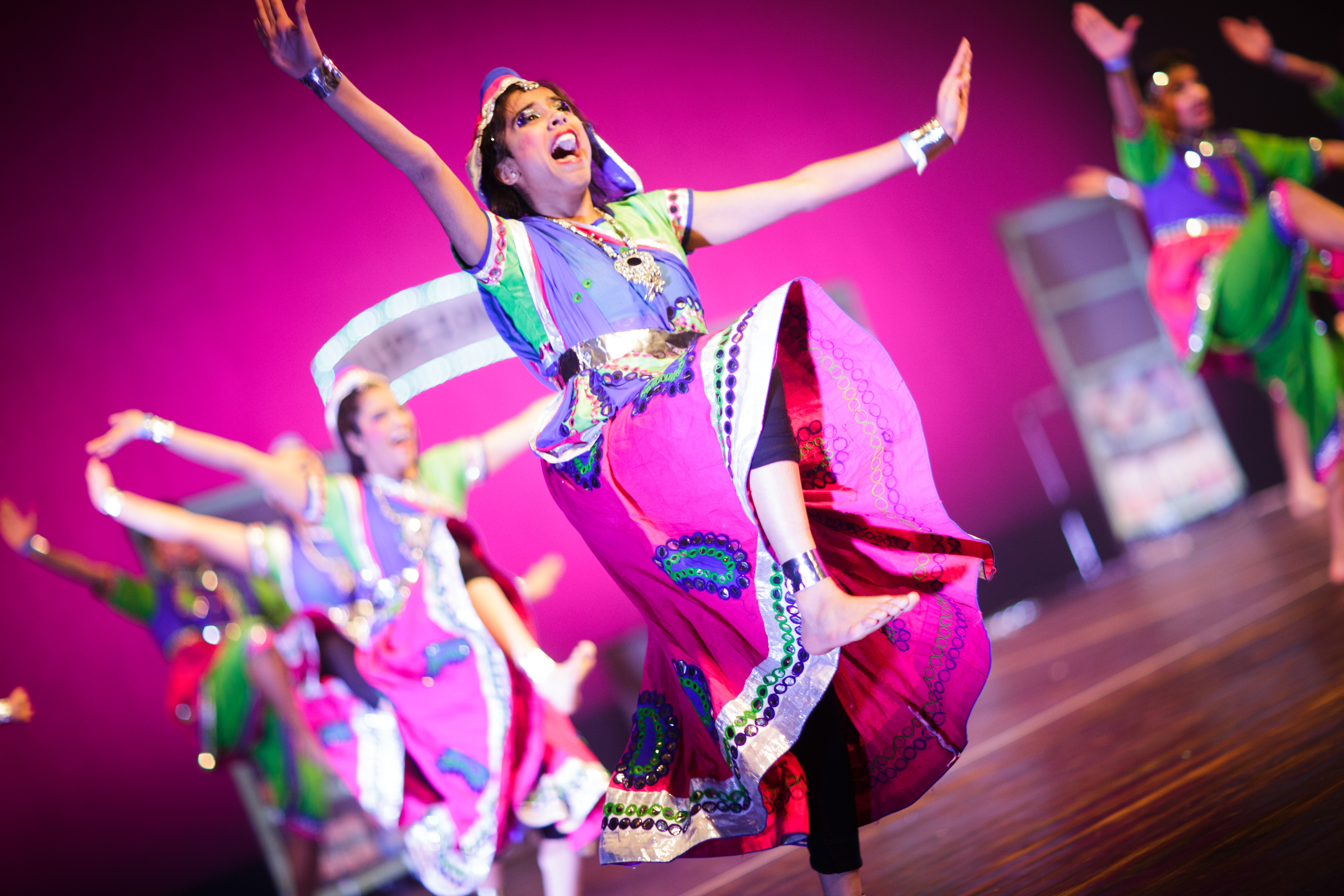 Dancers balance on one leg during the Raas Royalty Dance Competition in 2018. (Photo: Praneeth Gogineni) 