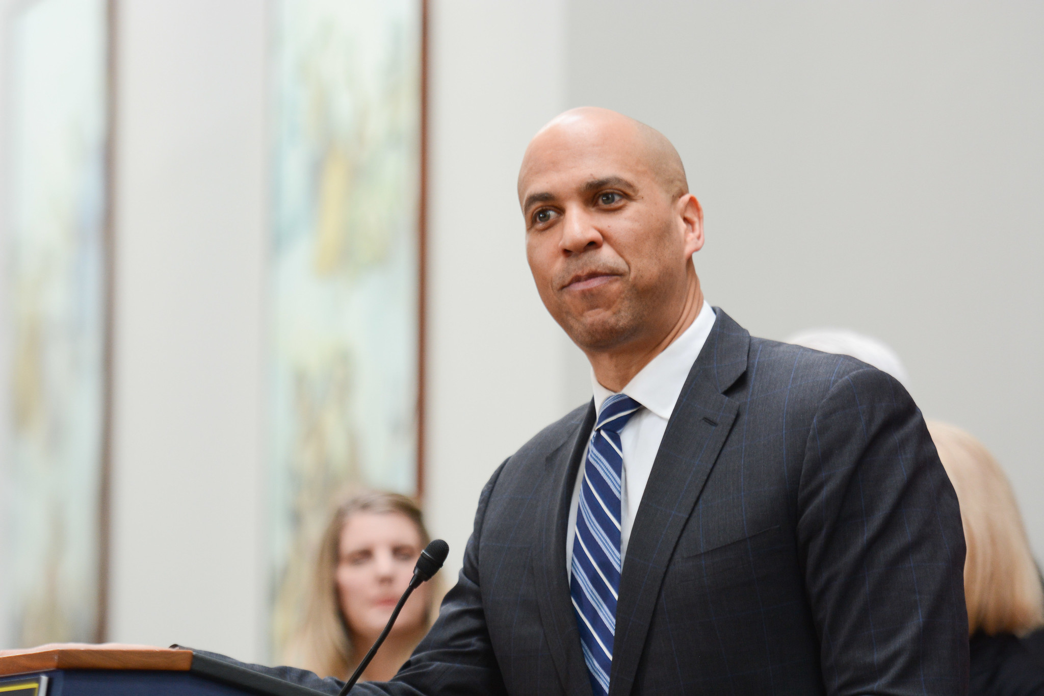 Senator Cory Booker standing at a podium