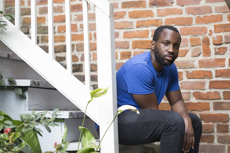 Chef Tunde Wey sitting on stairs