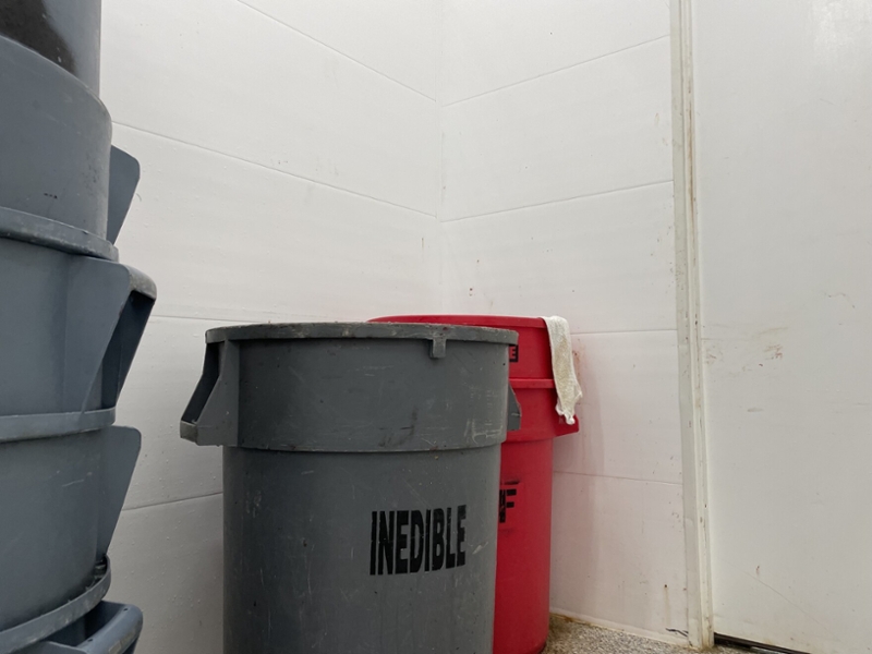 Barrels labeled 'INEDIBLE'