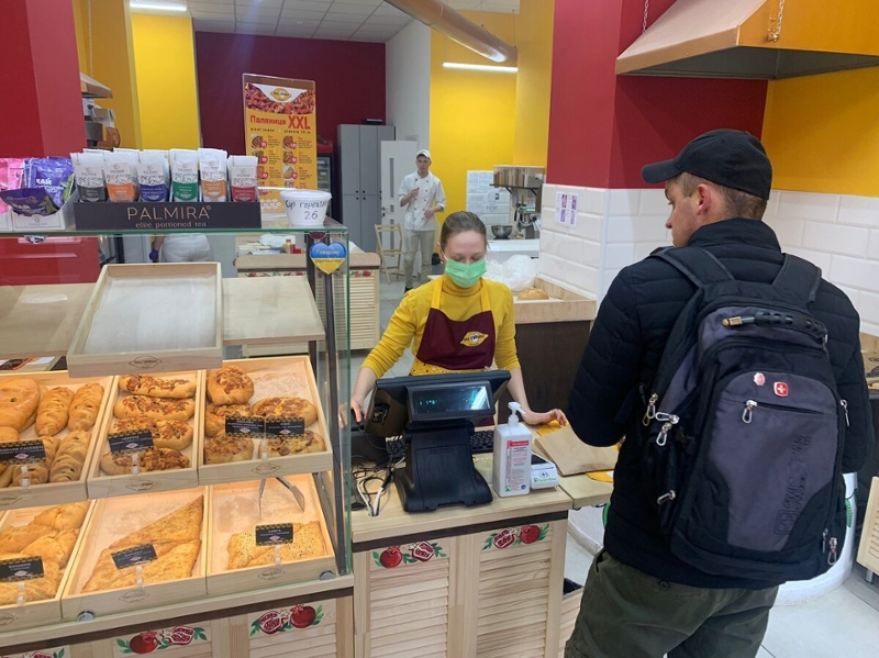 A cashier serving guests