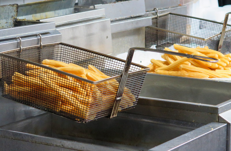 Churros being fried