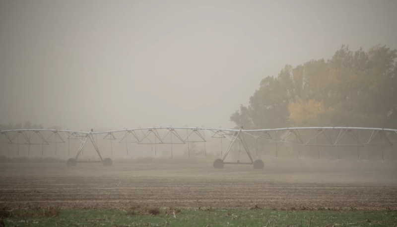 Strong winds blowing dust across a Kansas county 