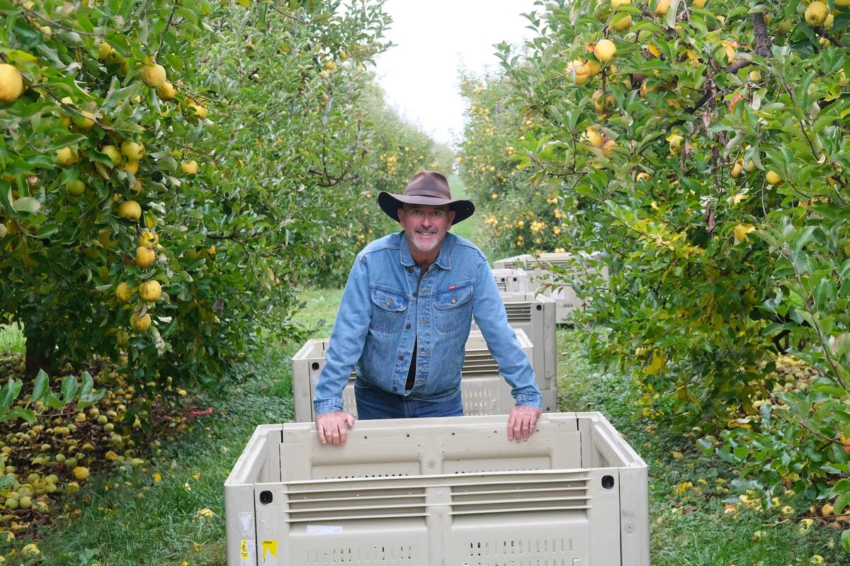 Man standing by a crate