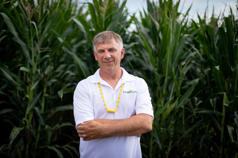 Lance Lilibridge standing in front of a corn field