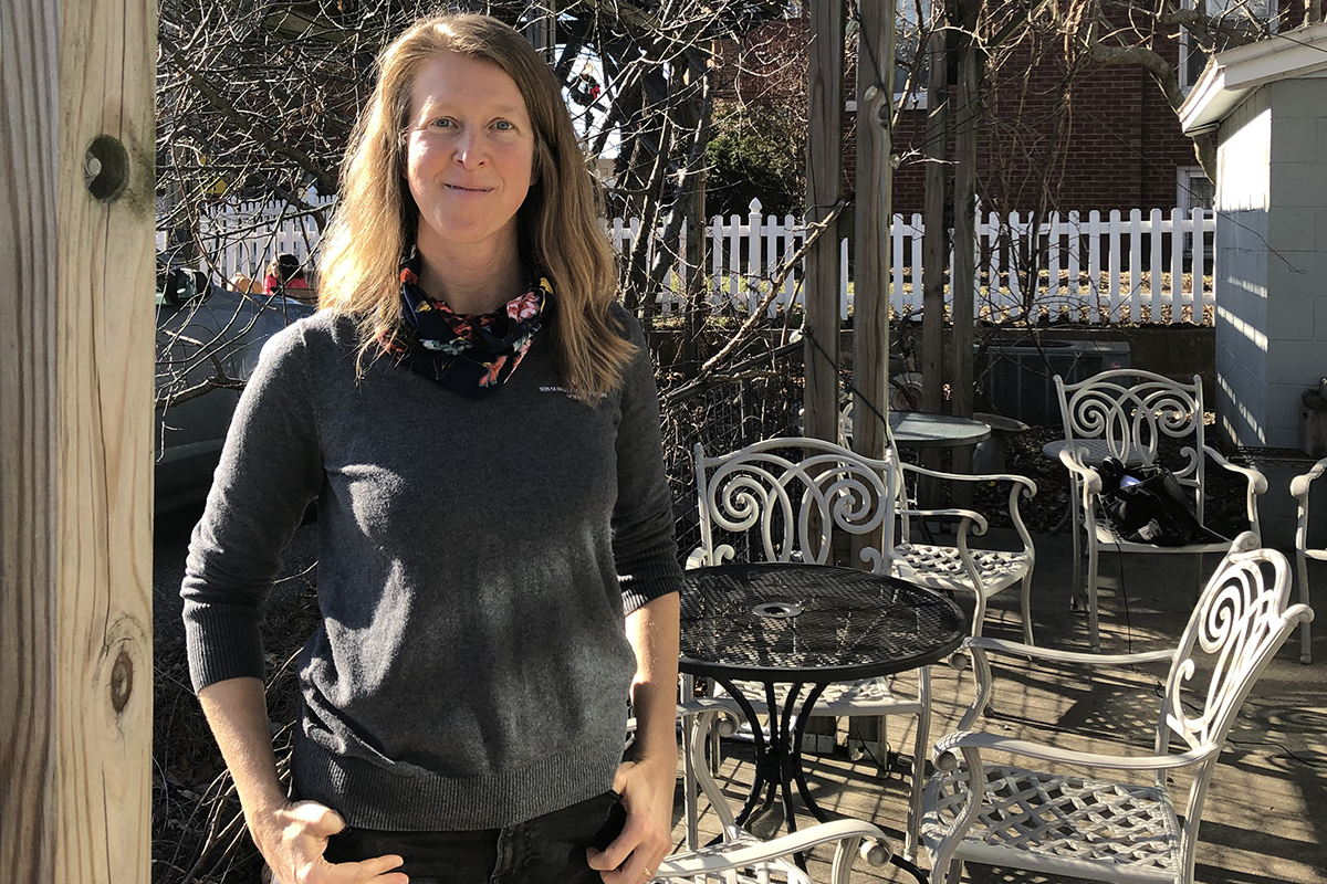 Julia Valliant standing on a sunny patio