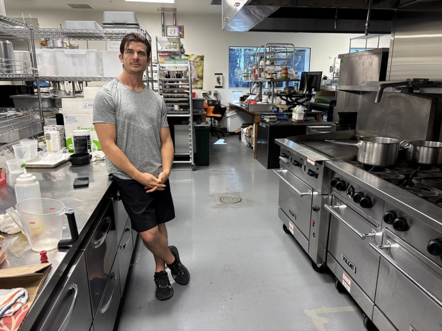 Josh Tetrick stands in a kitchen for a photograph