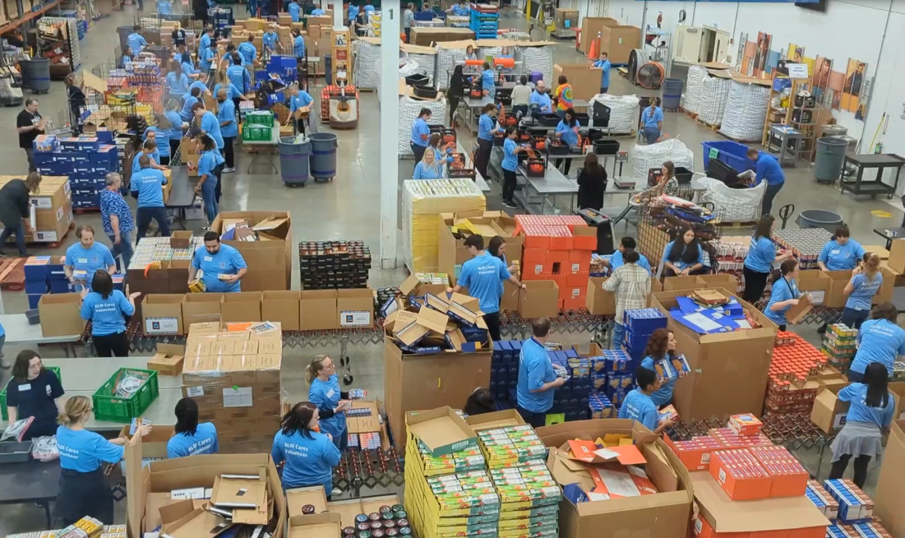 A warehouse in which workers are packaging food