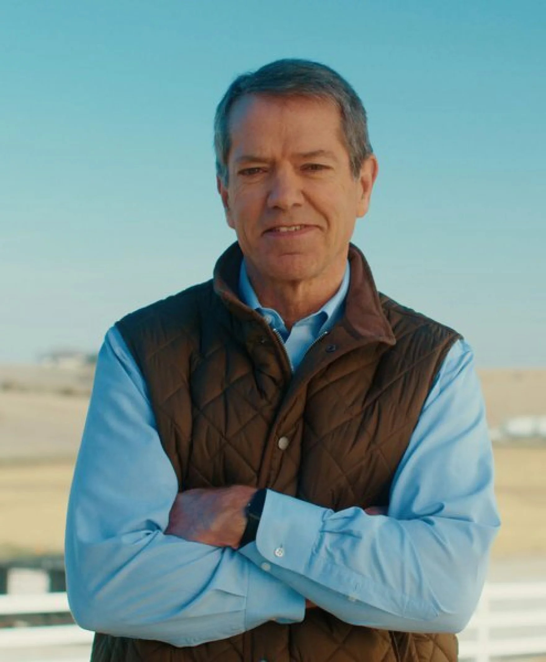 Gov. Jim Pillen poses with arms crossed for a picture