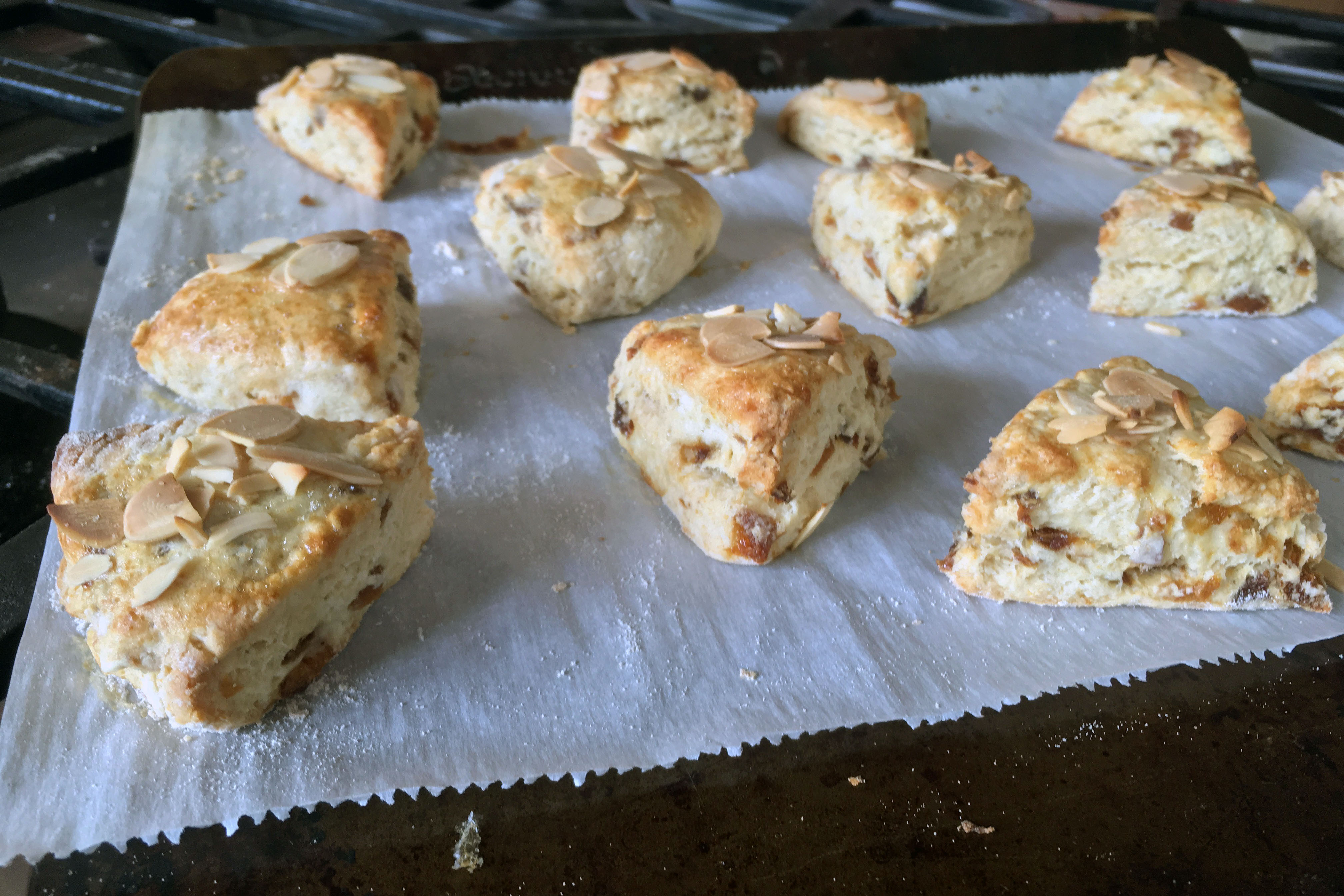 Triangle shaped scones on a baking sheet.