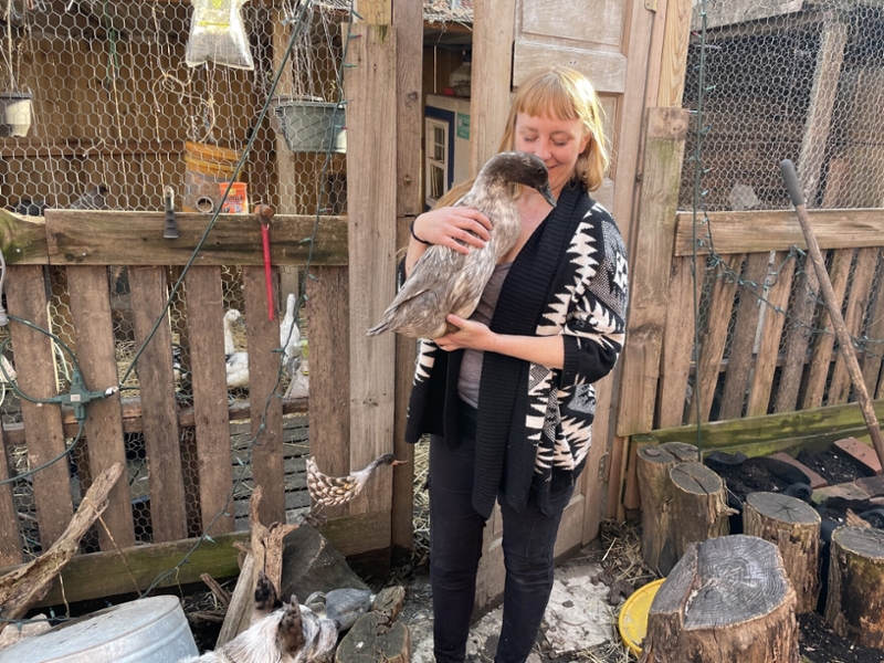 Kristin Dennis holding on of her ducks