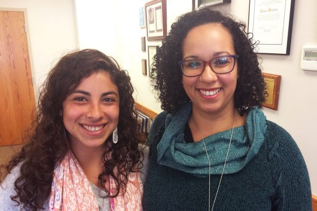 Stephanie Monserrate Torres and Marissa Reyes Diaz in a room looking at the camera and smiling .