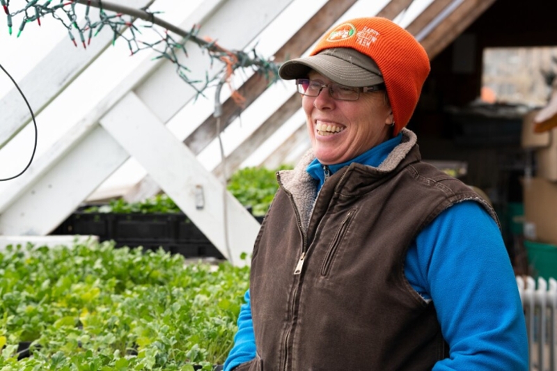 Liz Graznak inside greenhouse