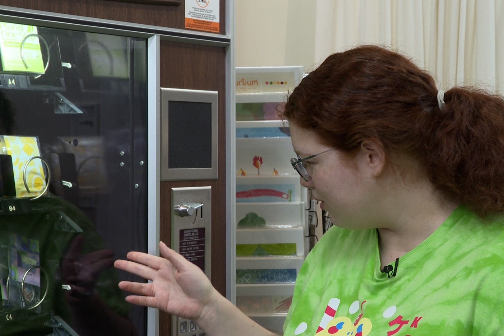 Gather shopkeeper Anna Halliday shows some of the items available in the vending machine.