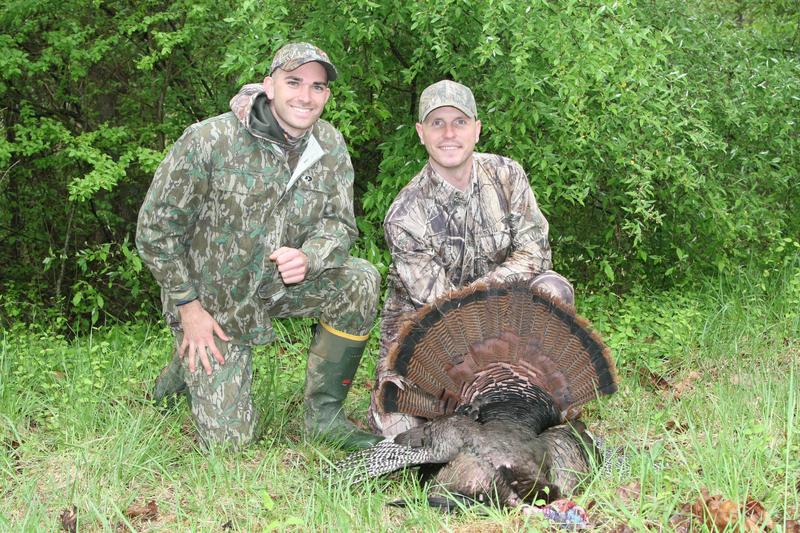 Kyle Allen, a Virginia state law enforcement officer, and Capt. Jacob Johnson, Marine Corps Systems Command, pose with a 20-pound turkey Johnson shot during a hunt at a Virginia Marine Corps base in 2016.
