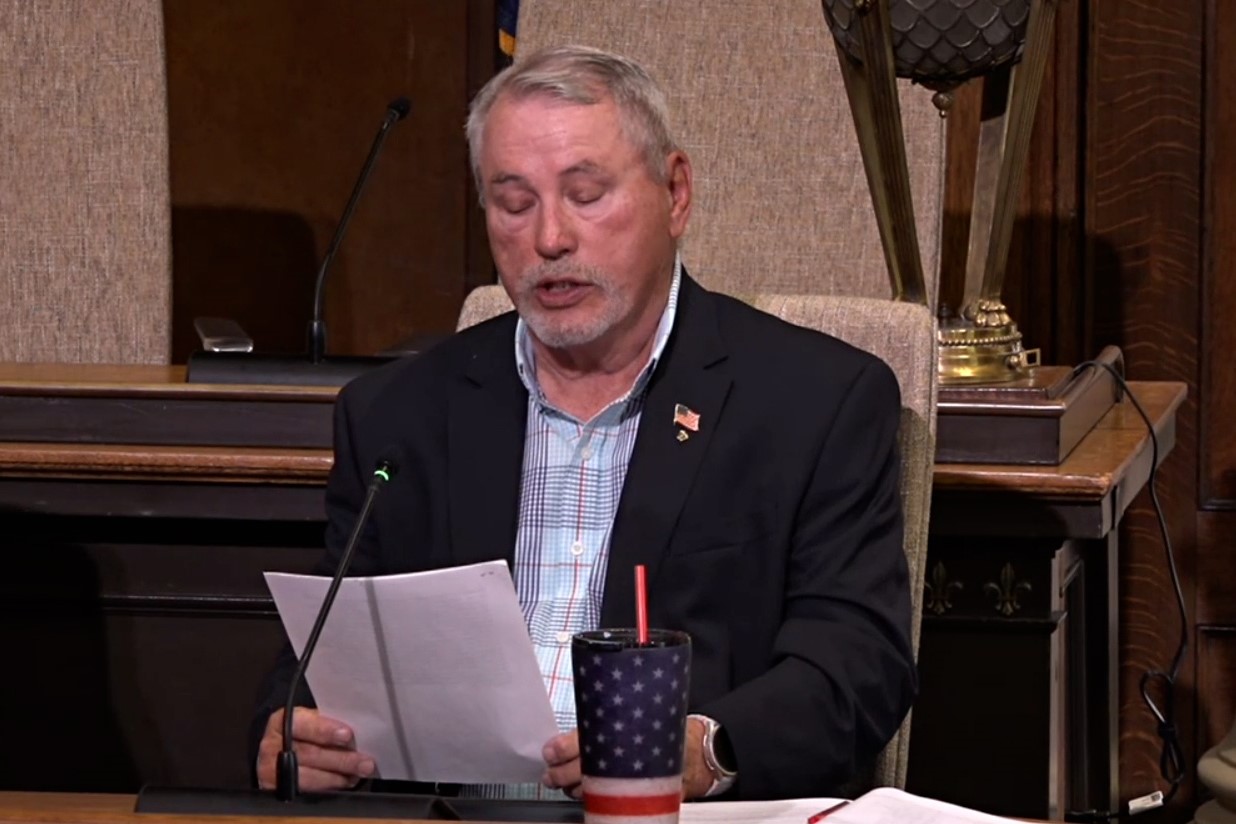 Republican election board member Danny Shields reads a prepared statement opposing the adoption of vote centers in Monroe County.