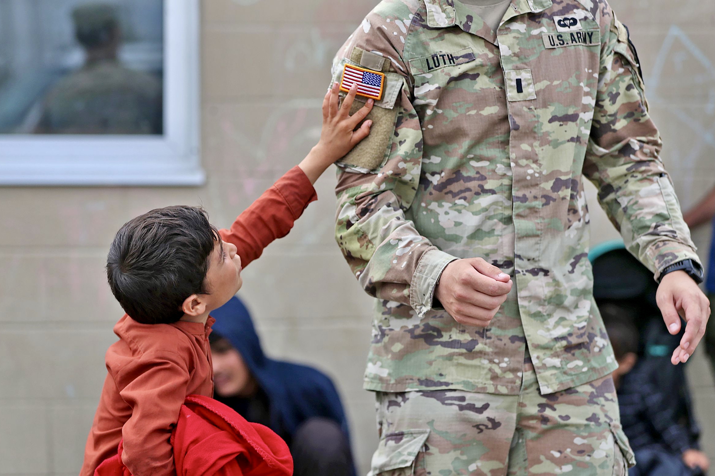 Afghan child and U.S. soldier at Camp Atterbury