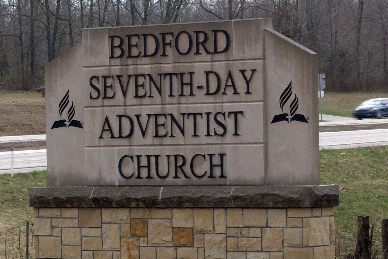 sign with road in background