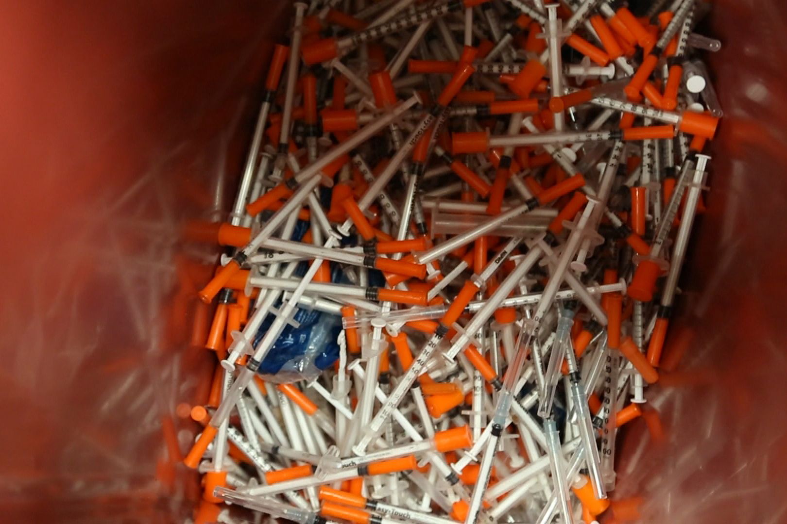 A bin of syringes.