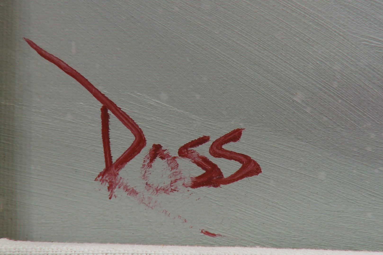 Bob Ross' signature on a painting.