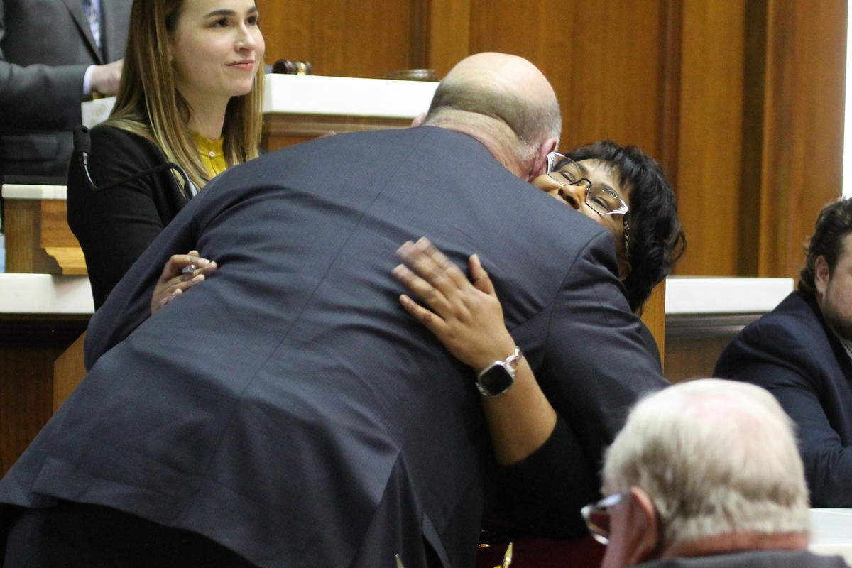 Rep. Brian Bosma (R-Indianapolis) and Rep. Cherrish Pryor (D-Indianapolis) embrace on the House floor.