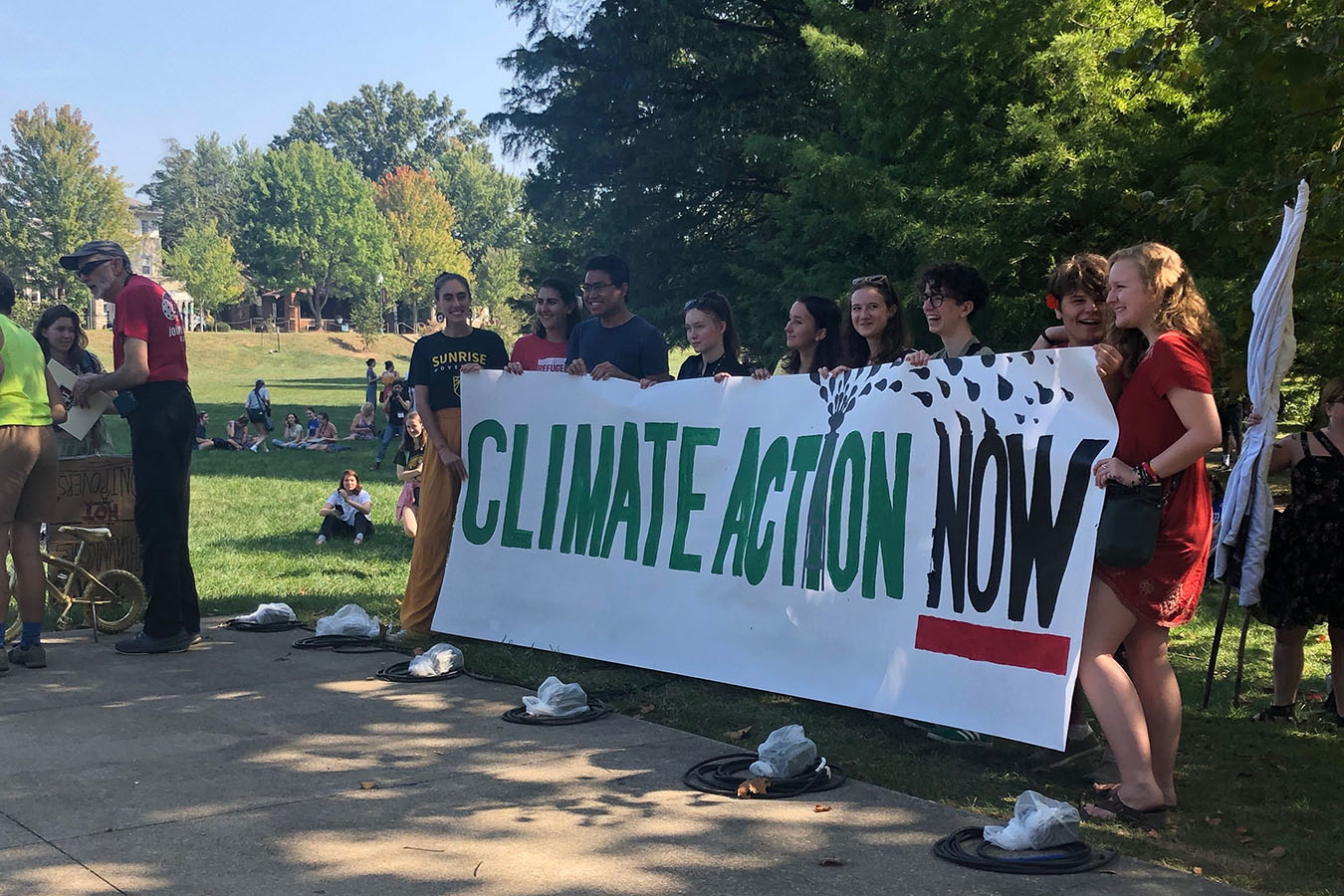 Climate activists hold a banner demanding climate change action at the Global Climate Strike walkout. 