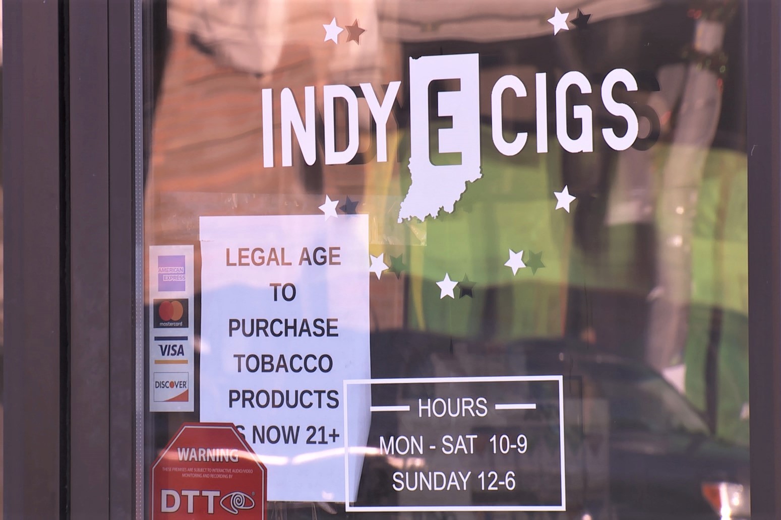 The door of Indy E-Cigs, a smoke and vape shop.