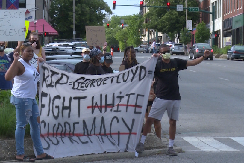 A photo of people protesting the death of George Floyd outside the Monroe County Courthouse.