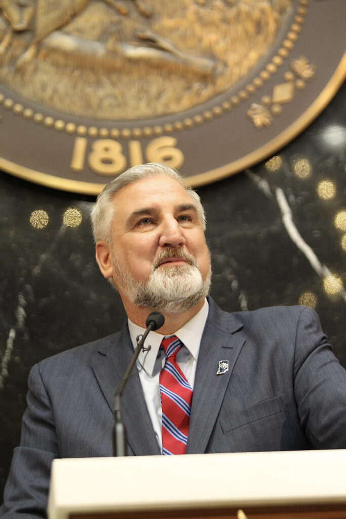 Gov. Eric Holcomb speaking in the Statehouse