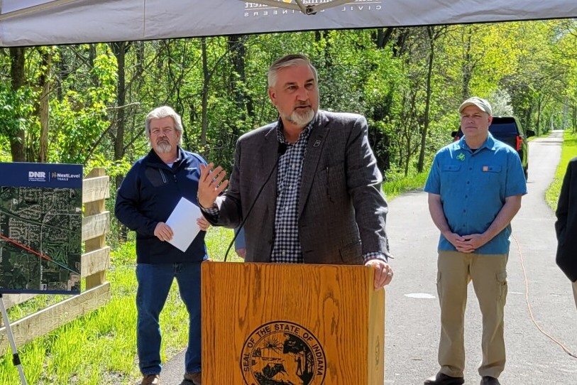 Gov. Eric Holcomb speaks during the ribbon cutting of the C&amp;O Greenway extension on April 30, 2024.
