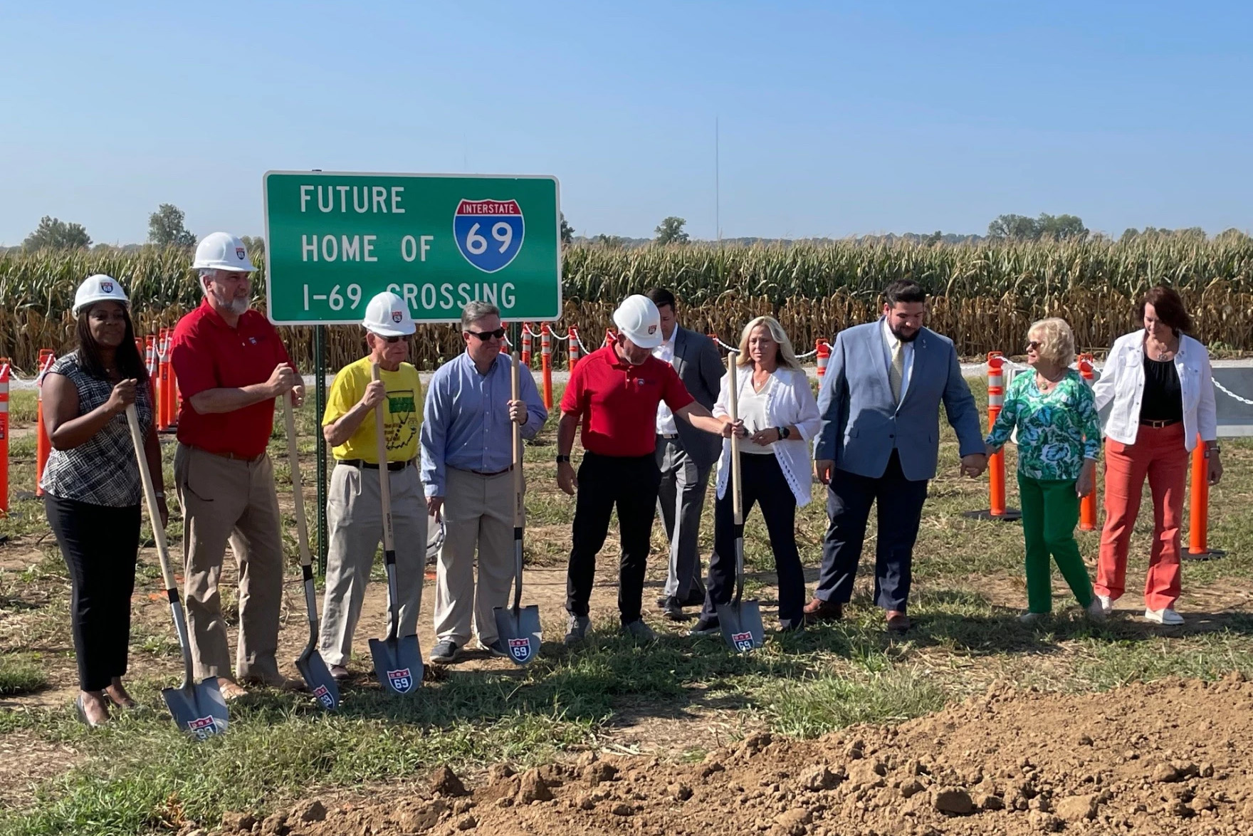 Officials break ground at the site of an approach to the I-69 Ohio River Crossing