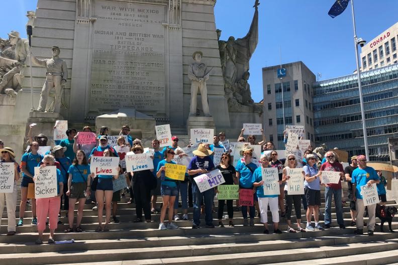 Protesters gather on Monument Circle to protest Gateway to Work.