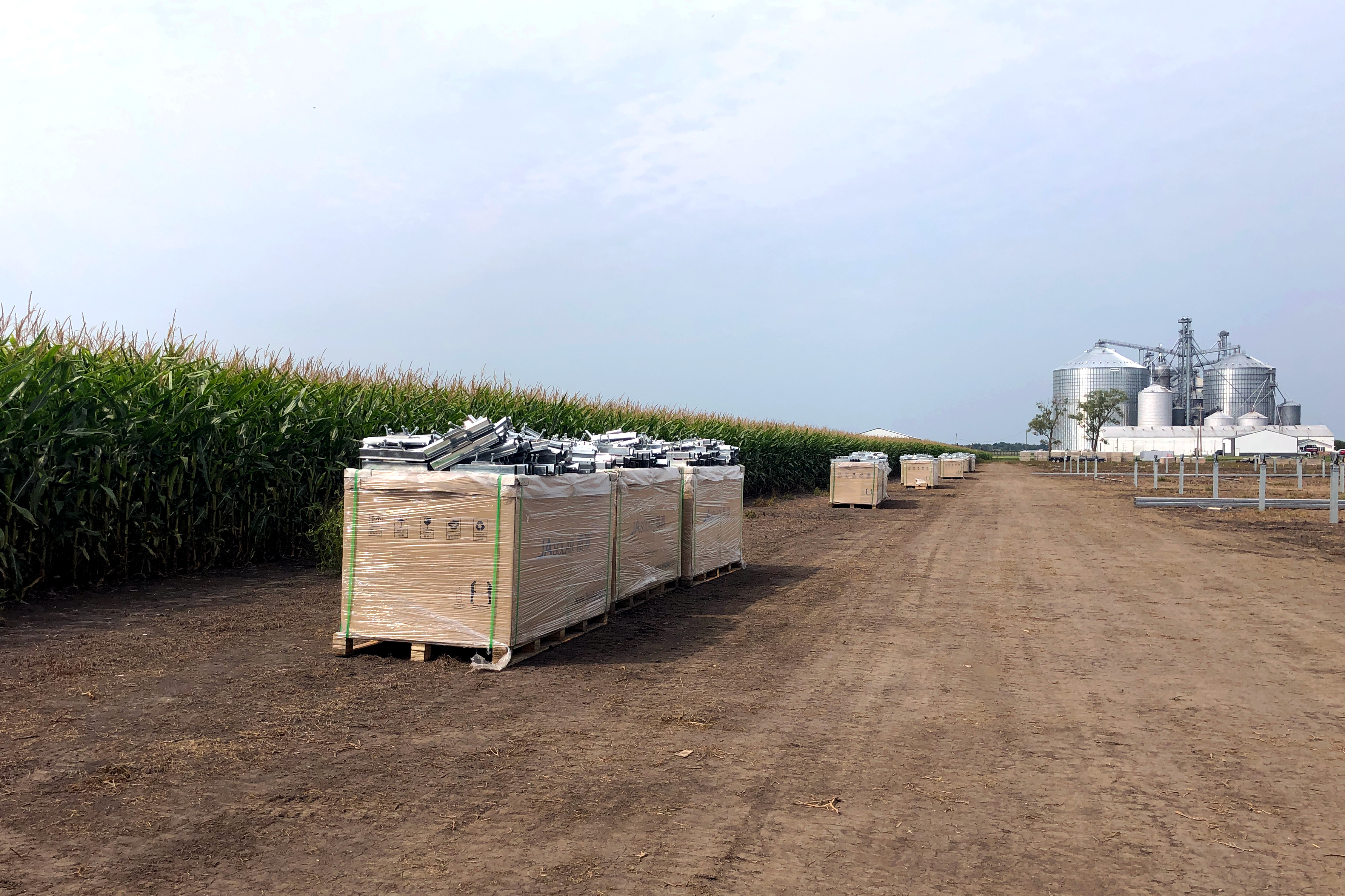 A box of solar panels waiting to be installed in a field in Indiana.