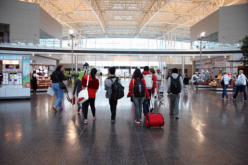 A photo of travelers in the lobby of the Indianapolis International Airport.