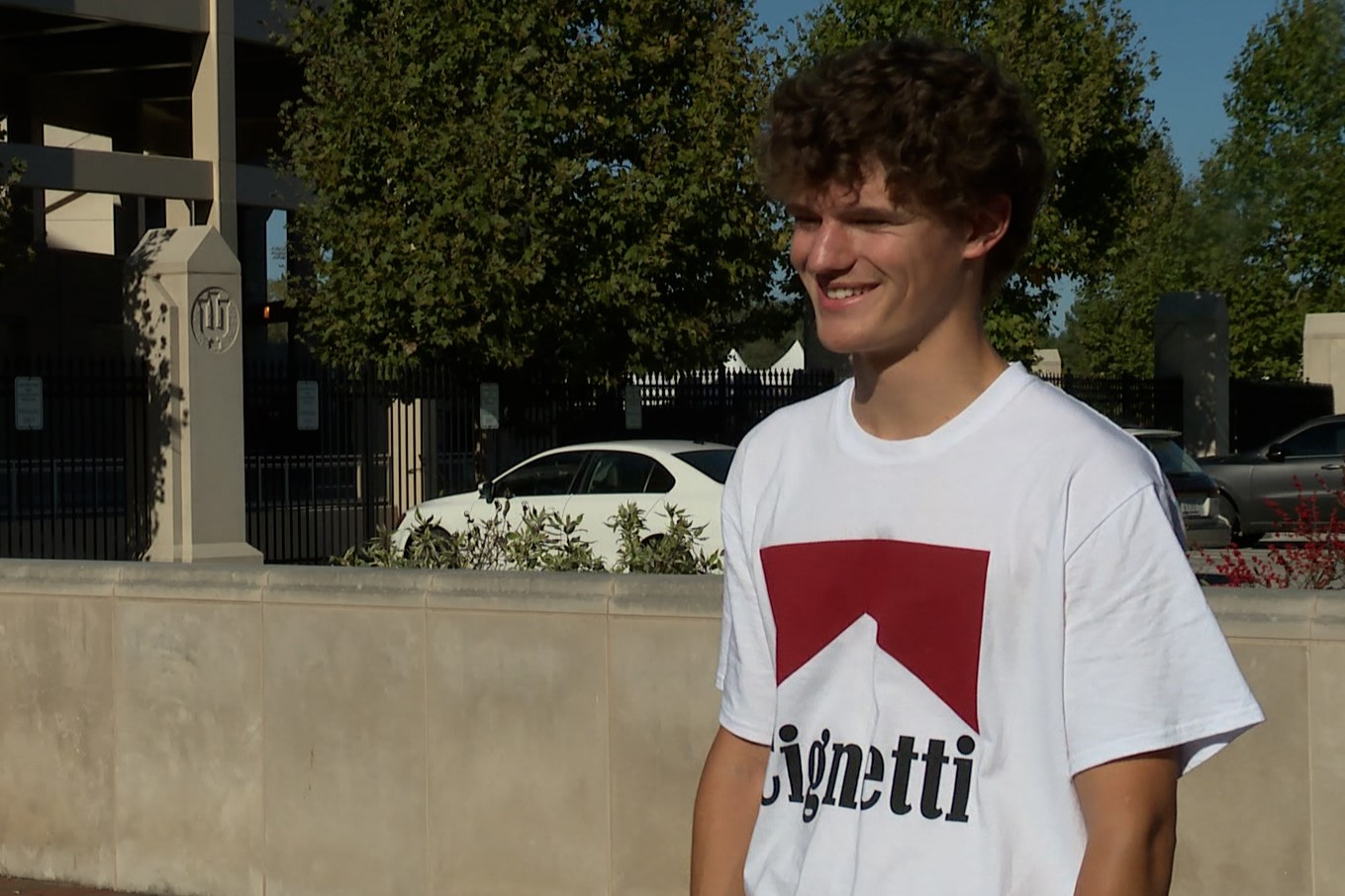 Issac Perlich wears his Cignetti shirt in an interview