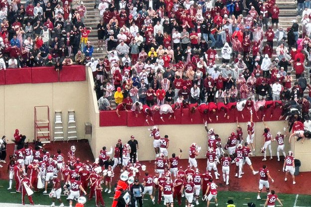 IU football players celebrate a 5-0 start with the student section Saturday after defeating Maryland.